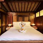 Tropical Traditional Indonesian Wooden Cottage In Ubud