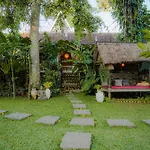 Tropical Traditional Indonesian Wooden Cottage In Ubud